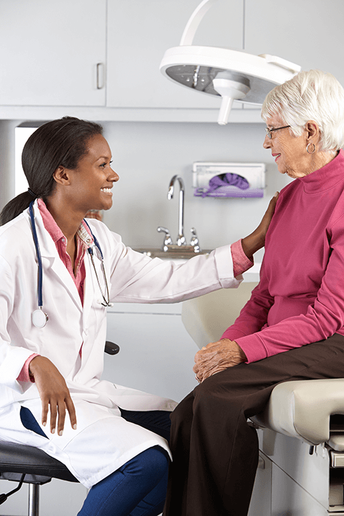 Female physician talking to female patient.