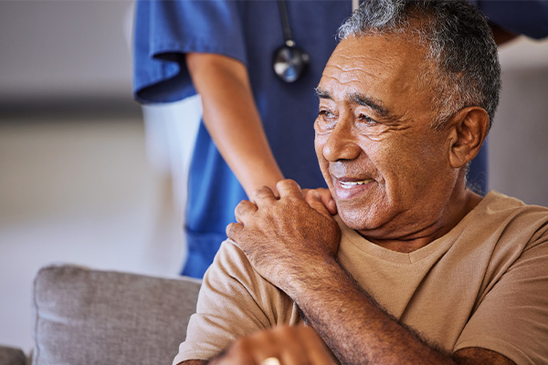 patient holding hand