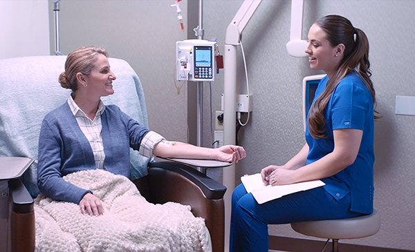 Karmanos nurse treating patient